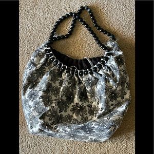 Fun Flowery woman’s canvas bag. With beaded handles.